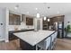 Modern kitchen with large island, stainless steel appliances, and breakfast bar at 18079 Ramble On Way, Land O Lakes, FL 34638