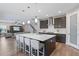 Modern kitchen with large island and breakfast bar seating at 18079 Ramble On Way, Land O Lakes, FL 34638