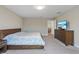 Main bedroom with king-size bed and walk-in closet at 18079 Ramble On Way, Land O Lakes, FL 34638