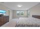 Spacious main bedroom with large bed and dresser at 18079 Ramble On Way, Land O Lakes, FL 34638