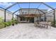 Spacious covered patio with comfortable seating at 18079 Ramble On Way, Land O Lakes, FL 34638