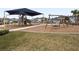 Community playground with a shaded play structure and swings at 18079 Ramble On Way, Land O Lakes, FL 34638