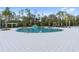 Circular pool with water slide and lounge area at 18079 Ramble On Way, Land O Lakes, FL 34638