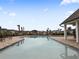Relaxing resort-style pool with lounge chairs and a cabana at 18079 Ramble On Way, Land O Lakes, FL 34638