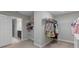 Spacious walk-in closet with ample shelving and hanging rods at 18079 Ramble On Way, Land O Lakes, FL 34638