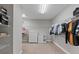 Large walk-in closet with shelving, hanging rods, and dresser at 18079 Ramble On Way, Land O Lakes, FL 34638