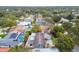 Aerial view showing home's location in a residential neighborhood with lush landscaping at 1824 Southwood Ln, Clearwater, FL 33764