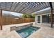 Backyard with spa, pergola, and patio at 1824 Southwood Ln, Clearwater, FL 33764