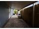 Spacious backyard patio with a wooden fence and lush landscaping at 1824 Southwood Ln, Clearwater, FL 33764