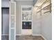 Double vanity bathroom with modern dark cabinets and a frosted glass door at 1824 Southwood Ln, Clearwater, FL 33764