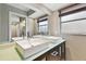 Double vanity bathroom with modern dark cabinets at 1824 Southwood Ln, Clearwater, FL 33764