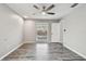 Bedroom with wood-look floors, pool view, and ceiling fan at 1824 Southwood Ln, Clearwater, FL 33764