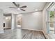 Bright bedroom with ceiling fan and laminate wood flooring at 1824 Southwood Ln, Clearwater, FL 33764