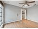 Spacious bedroom featuring wood floors and a large closet at 1824 Southwood Ln, Clearwater, FL 33764