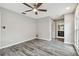 Spacious bedroom with wood-look floors and a ceiling fan at 1824 Southwood Ln, Clearwater, FL 33764