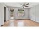 Bright bedroom with wood flooring and patio access at 1824 Southwood Ln, Clearwater, FL 33764