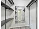 Walk-in closet with ample shelving and hanging space at 1824 Southwood Ln, Clearwater, FL 33764