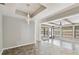 Open dining area with wood beams, tile floors and views to sunroom at 1824 Southwood Ln, Clearwater, FL 33764