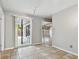 Dining area with tile floors and sliding glass door to patio at 1824 Southwood Ln, Clearwater, FL 33764