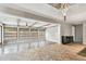 Sunroom with wood beams, dark hardwood floors and multiple windows at 1824 Southwood Ln, Clearwater, FL 33764