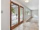 Tile entryway with double doors leading to living room at 1824 Southwood Ln, Clearwater, FL 33764