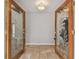 Bright entryway with tiled floors and double doors at 1824 Southwood Ln, Clearwater, FL 33764