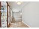 View from entryway into living area with hardwood floors at 1824 Southwood Ln, Clearwater, FL 33764