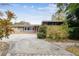 Ranch style home with circular driveway and mature landscaping at 1824 Southwood Ln, Clearwater, FL 33764