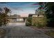 Ranch style home with circular driveway and mature landscaping at 1824 Southwood Ln, Clearwater, FL 33764