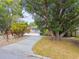 Charming curb appeal with mature trees and landscaped yard at 1824 Southwood Ln, Clearwater, FL 33764