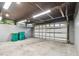 Spacious garage with extra storage cabinets and overhead door at 1824 Southwood Ln, Clearwater, FL 33764