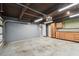 Garage with storage cabinets and an overhead door at 1824 Southwood Ln, Clearwater, FL 33764