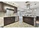 Modern kitchen with stainless steel appliances, granite countertops and dark cabinets at 1824 Southwood Ln, Clearwater, FL 33764