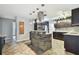 Modern kitchen with dark cabinets, granite counters, and a large island at 1824 Southwood Ln, Clearwater, FL 33764