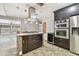 Island kitchen with stainless steel appliances and granite countertops at 1824 Southwood Ln, Clearwater, FL 33764