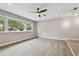 Spacious living room featuring hardwood floors and abundant natural light at 1824 Southwood Ln, Clearwater, FL 33764