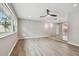 Bright living room with hardwood floors and large windows at 1824 Southwood Ln, Clearwater, FL 33764