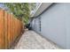Side yard with brick pathway and fence at 1824 Southwood Ln, Clearwater, FL 33764