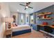 Cozy bedroom with built-in desk and window seating at 18437 Purple Creek Ln, Lutz, FL 33549
