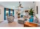 Comfortable bonus room with sectional sofa and built-in shelving at 18437 Purple Creek Ln, Lutz, FL 33549