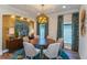 Elegant dining room featuring a round table and stylish light fixture at 18437 Purple Creek Ln, Lutz, FL 33549