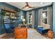 Spacious home office with built-in shelving and stylish furnishings at 18437 Purple Creek Ln, Lutz, FL 33549