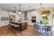 Modern kitchen with large island, stainless steel appliances, and stylish backsplash at 18437 Purple Creek Ln, Lutz, FL 33549