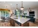 Open concept kitchen and living area with stylish decor and a view to the backyard at 18437 Purple Creek Ln, Lutz, FL 33549