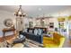 Bright living room with comfortable seating and large windows at 18437 Purple Creek Ln, Lutz, FL 33549