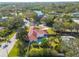 Ranch-style home with pool, lush landscaping, and corner lot at 2430 Roberta Ln, Clearwater, FL 33764