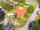 Single-story home with red tile roof, located on a corner lot at 2430 Roberta Ln, Clearwater, FL 33764