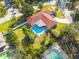 Aerial view showing home, pool, and large backyard at 2430 Roberta Ln, Clearwater, FL 33764
