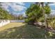 Expansive backyard with lush lawn and privacy fence at 2430 Roberta Ln, Clearwater, FL 33764