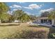 Large backyard with grassy area and pool at 2430 Roberta Ln, Clearwater, FL 33764